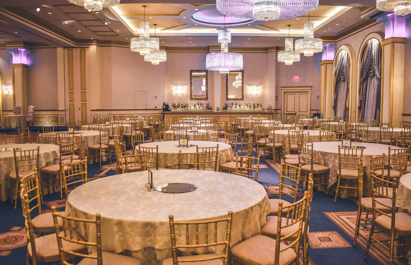 Ballroom lit with warm professional event lighting